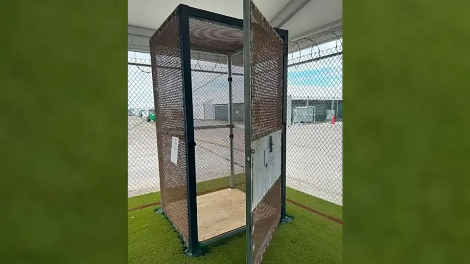 Photo for: 'Alligator Alcatraz' detainees were confined to small metal enclosures, DHS inspector general finds